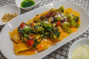 Pasta in Romesko sauce with vegetables and cottage cheese