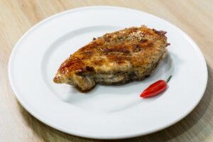 Pork juicy steak: a recipe in a pan