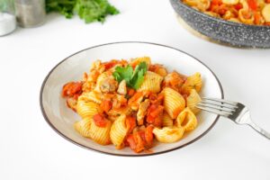 Macaron with chicken in a pan