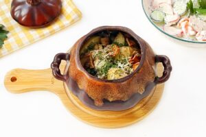 Potatoes with mushrooms in pots