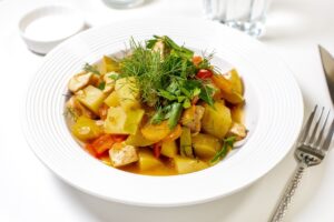 Vegetable stew with chicken in a pan