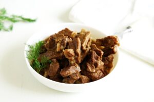Stewed beef with onions in a pan
