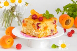 Pouring pie with apricots and raspberries