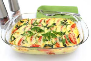 Zucchini with tomatoes and cheese in the oven