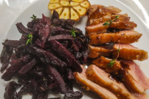 Duck in mustard sauce with baked beetle