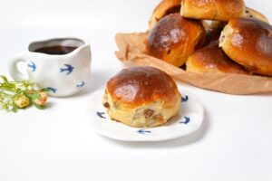 Lush bunches with raisins from yeast dough