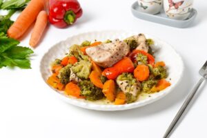 Chicken with vegetables in foil portioned