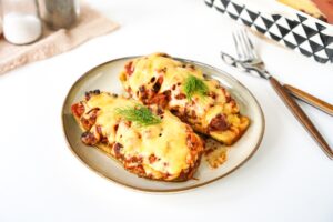 Baked zucchini with minced meat in sauce
