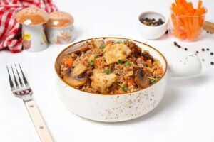 Buckwheat with chicken and mushrooms in a frying pan