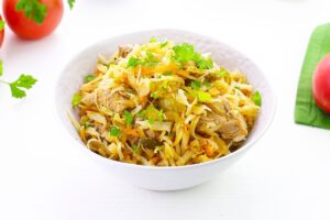 Cabbage solyanka with meat in a frying pan