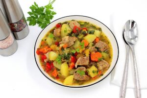 Stewed potatoes with pork in a pan