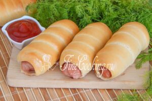 Sausages in yeast dough in the oven