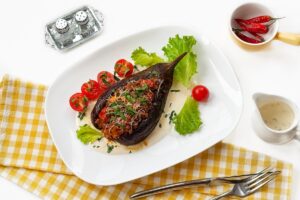 Broken eggplants with minced meat and cheese