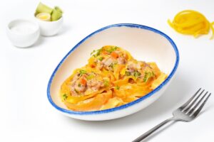 Pasta nests with minced meat in a frying pan